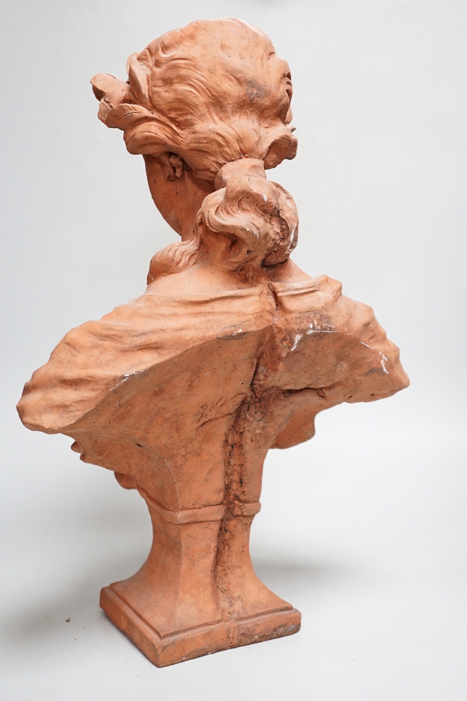 An Art Nouveau-style terracotta portrait bust of a young girl, 46cm high